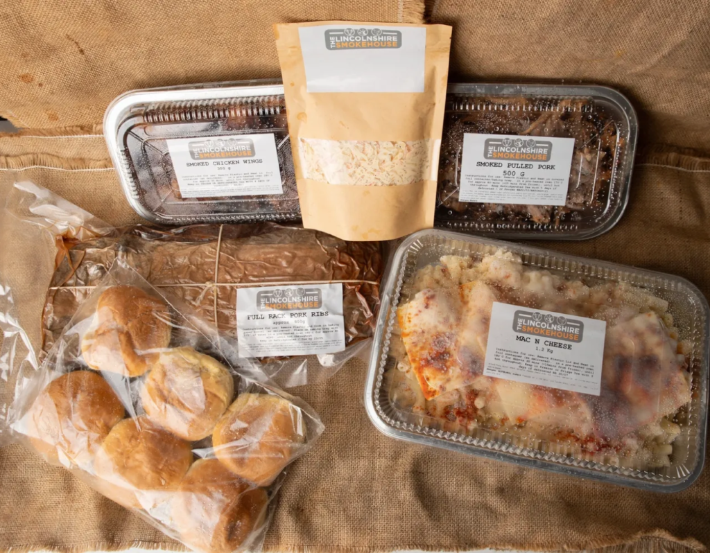 Packaged food assortment on burlap background