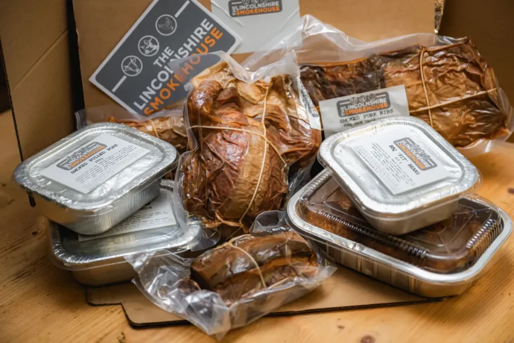 Variety of packaged smoked meats displayed