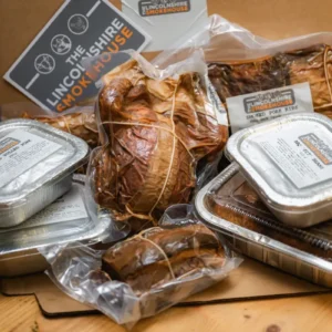 Variety of packaged smoked meats displayed